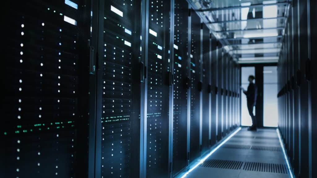 Photo of Out of Focus IT Technician Turning on Data Server.